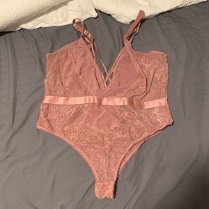 Blush pink lace body suit. Never worn
